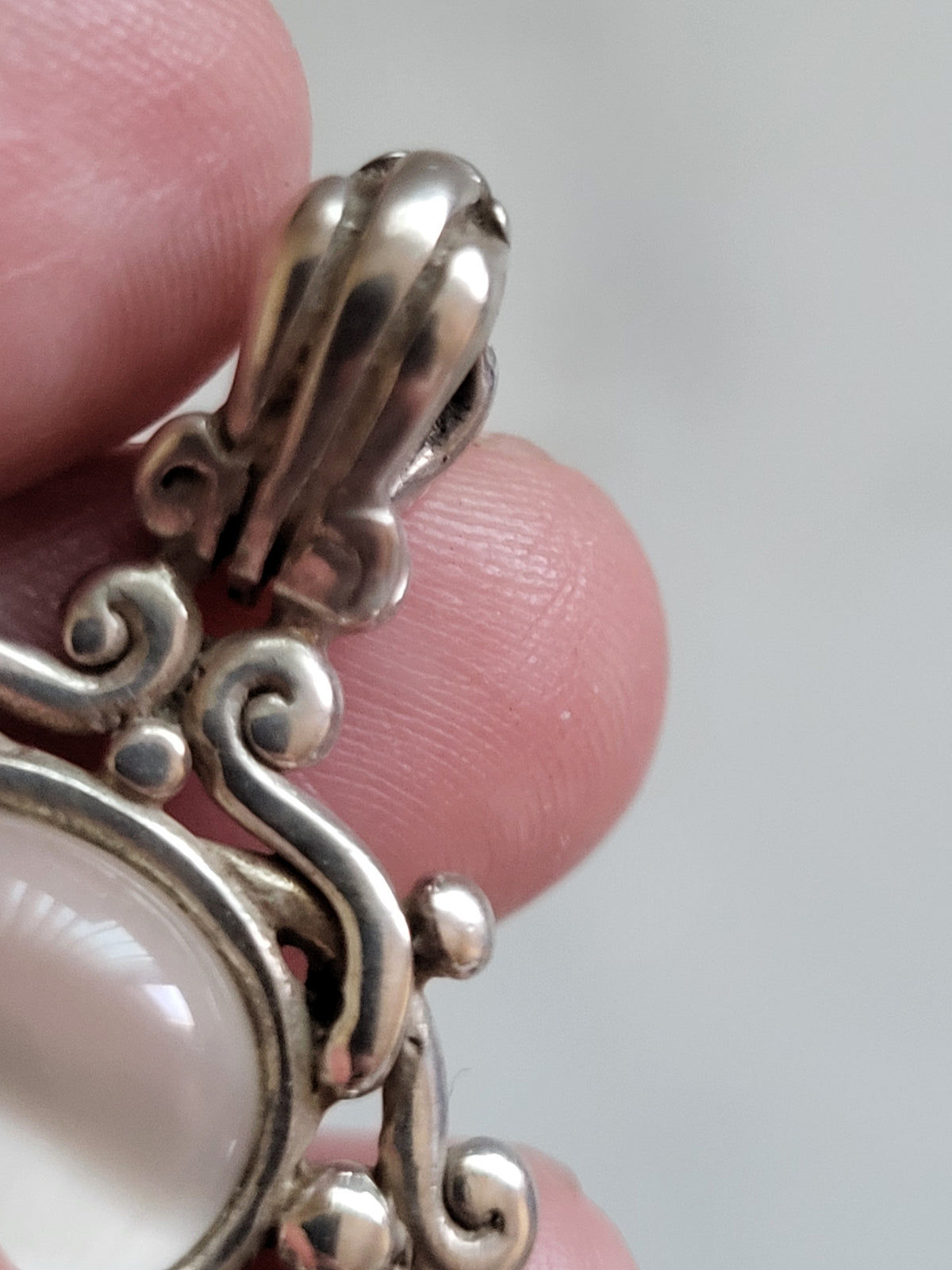 Vintage Sterling Silver White Cat’s Eye Scrollwork Pendant