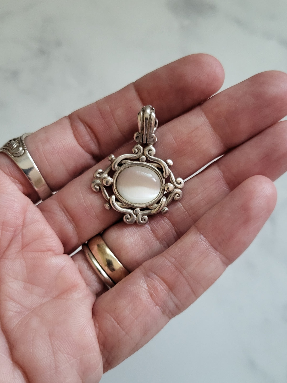 Vintage Sterling Silver White Cat’s Eye Scrollwork Pendant