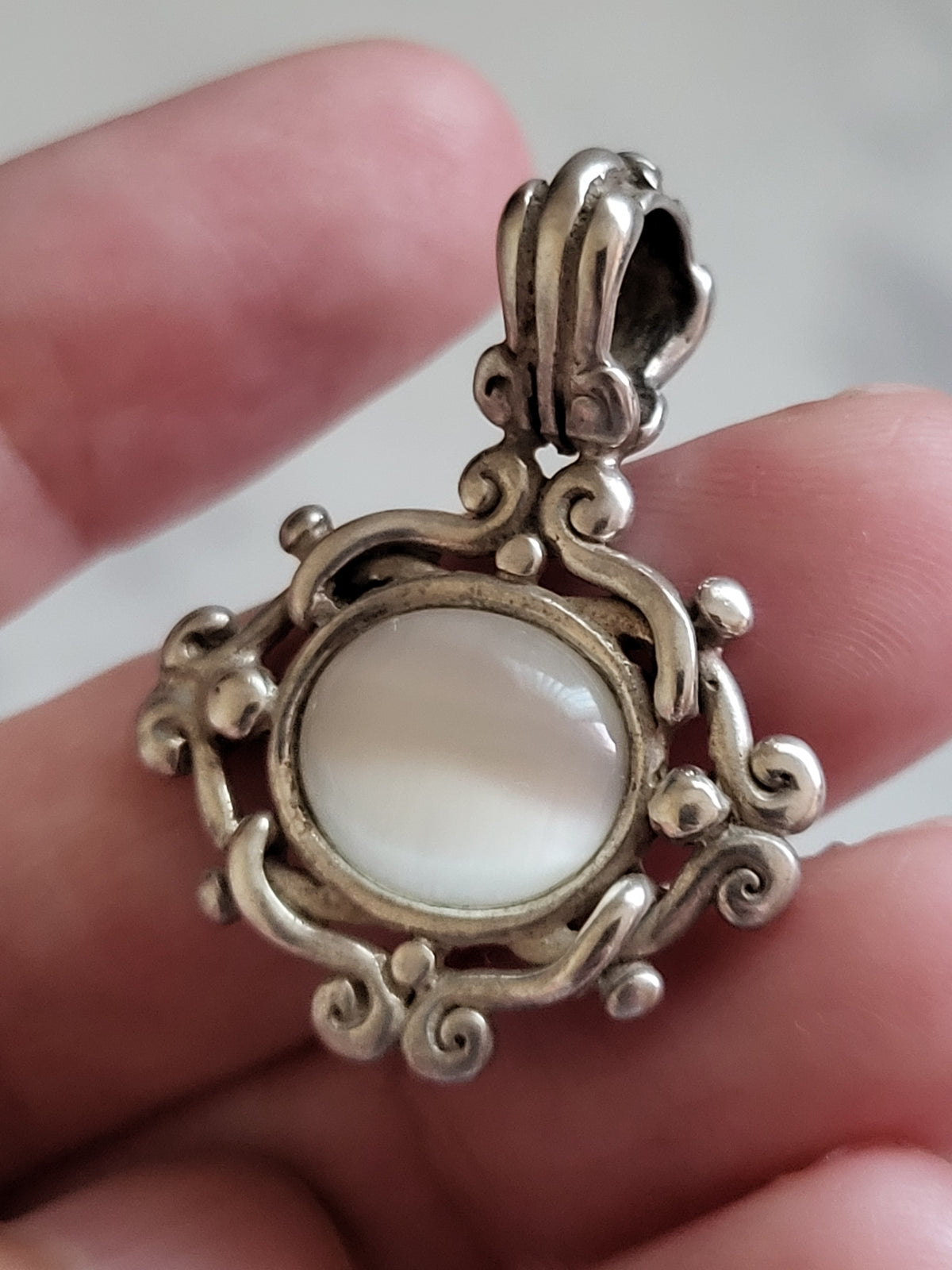 Vintage Sterling Silver White Cat’s Eye Scrollwork Pendant