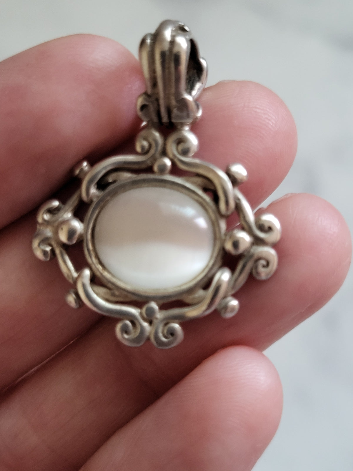 Vintage Sterling Silver White Cat’s Eye Scrollwork Pendant